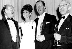 Jack L. Warner, Audrey Hepburn, Rex Harrison en George Cukor
